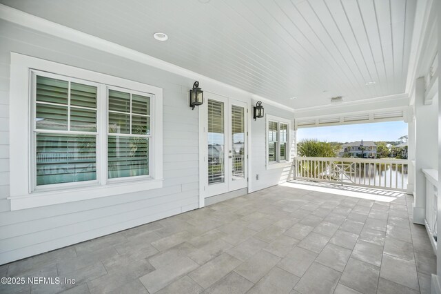 view of patio featuring a water view