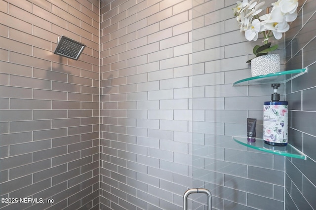 full bathroom with a tile shower