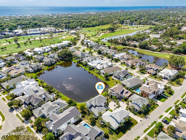 bird's eye view featuring a water view, a residential view, and golf course view