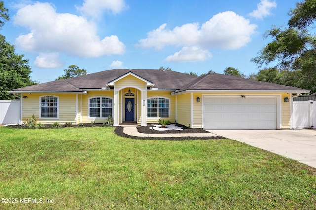 12139 Cap Ferrat St, Jacksonville, FL 32224 - ranch-style home featuring a front lawn, driveway, a garage, and fence
