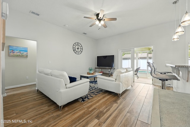 12139 Cap Ferrat St, Jacksonville, FL 32224 - living area featuring ceiling fan, light wood-style flooring, baseboards, and visible vents