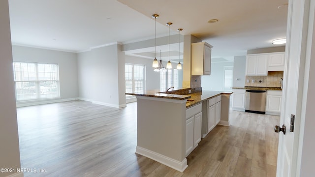 400 E Bay St Unit 1610-1611, Jacksonville, FL 32202 - kitchen with light wood-style floors, dark stone countertops, backsplash, and dishwasher