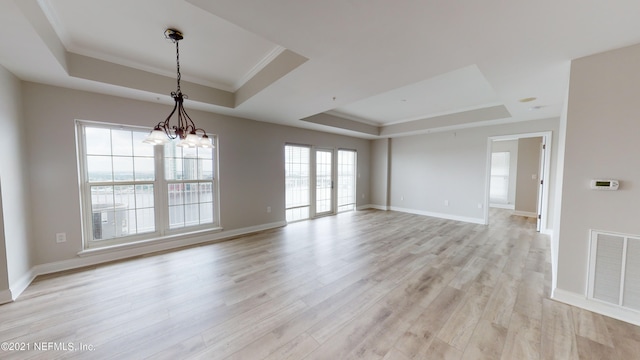 400 E Bay St Unit 1610-1611, Jacksonville, FL 32202 - unfurnished room with crown molding, a raised ceiling, light wood-style flooring, and visible vents