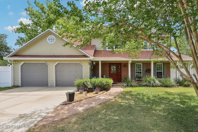 5914 Orchard Pond Dr, Fleming Island, FL 32003 - view of front of home with an attached garage, driveway, and brick siding