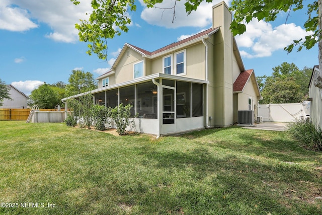 5914 Orchard Pond Dr, Fleming Island, FL 32003 - rear view of house with a sunroom, a chimney, and cooling unit