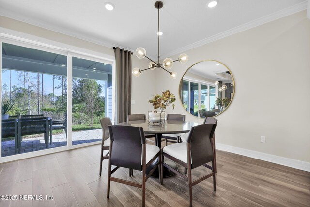 568 Blind Oak Cir, Saint Augustine, FL 32095 - dining room featuring plenty of natural light, baseboards, ornamental molding, and a notable chandelier