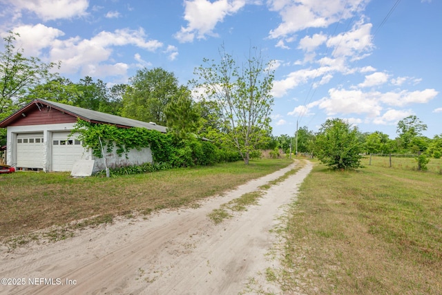 view of road with driveway