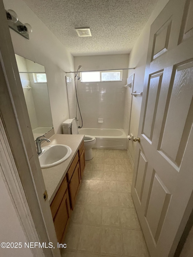 2990 Brittany Bluff Dr, Orange Park, FL 32073 - full bathroom featuring a textured ceiling, visible vents, vanity, toilet, and bathing tub / shower combination