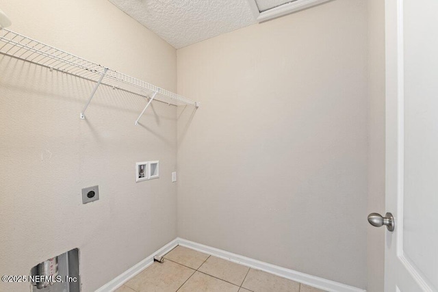 3149 Silverado Cir, Green Cove Springs, FL 32043 - washroom featuring washer hookup, baseboards, hookup for an electric dryer, light tile patterned floors, and a textured ceiling