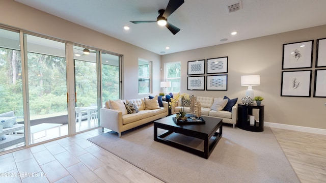 living room with visible vents, recessed lighting, baseboards, and ceiling fan