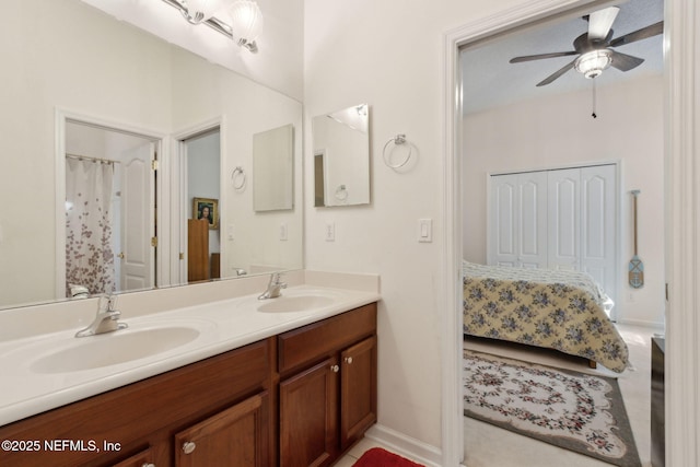 full bathroom with connected bathroom, double vanity, a ceiling fan, and a sink
