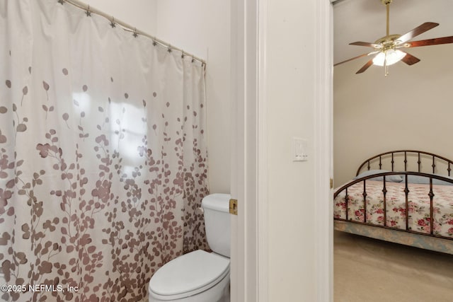 bathroom with toilet and ceiling fan