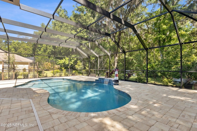 outdoor pool with a lanai and a patio