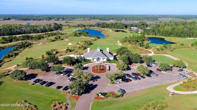 aerial view with a water view and view of golf course