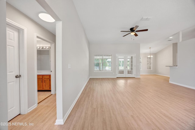 unfurnished living room featuring ceiling fan, french doors, visible vents, light wood-type flooring, and baseboards