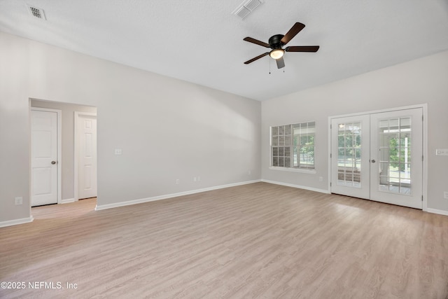 unfurnished living room with a ceiling fan, visible vents, french doors, and light wood-style floors