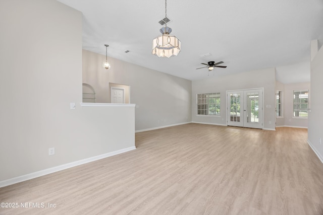unfurnished living room featuring ceiling fan, french doors, visible vents, light wood-type flooring, and baseboards