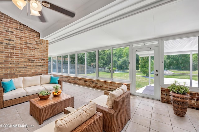 sunroom with a ceiling fan and outdoor lounge area