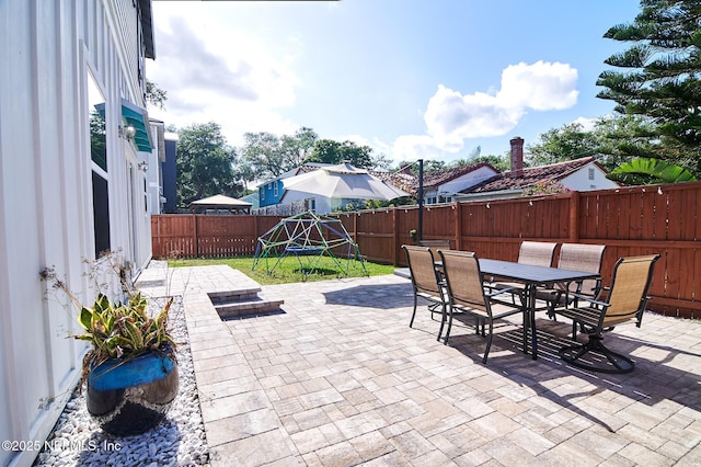view of patio / terrace with outdoor dining space and a fenced backyard