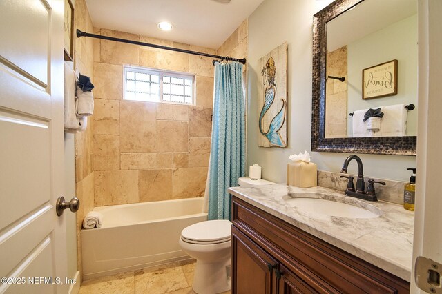 full bathroom featuring toilet, vanity, and shower / bath combo with shower curtain