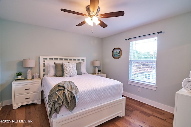 bedroom with dark wood-style flooring, baseboards, and ceiling fan