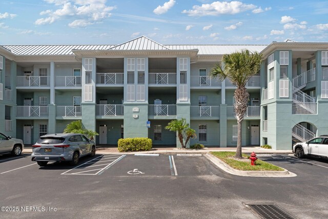 view of property with uncovered parking