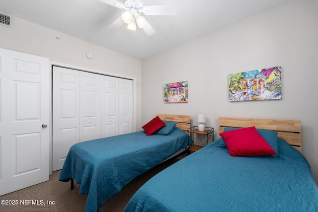 bedroom with a closet, carpet flooring, and ceiling fan