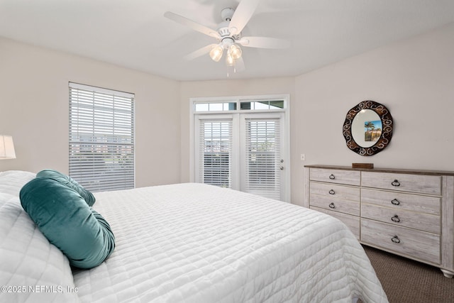 bedroom with ceiling fan, access to exterior, and dark colored carpet