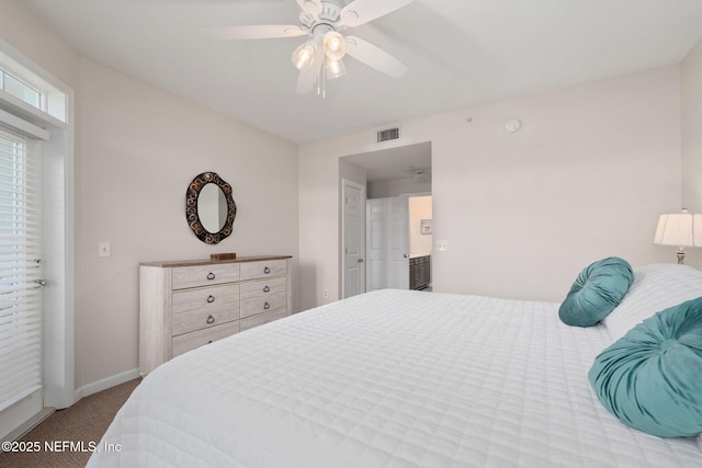 carpeted bedroom featuring baseboards, ceiling fan, and visible vents