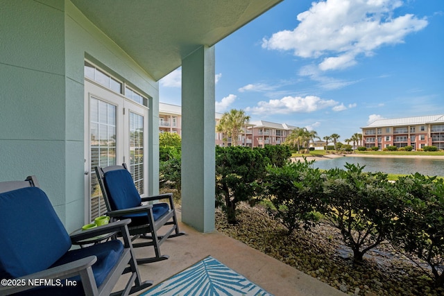 balcony featuring a water view