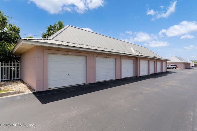garage featuring fence