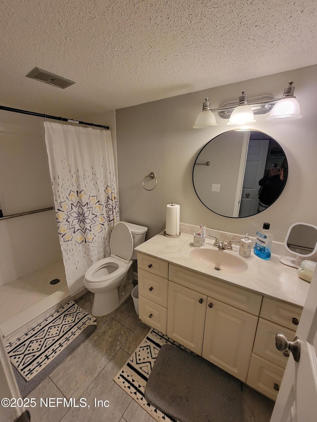 3857 Mission Dr Unit 3, Jacksonville, FL 32217 - full bath with a textured ceiling, vanity, a shower with curtain, and toilet
