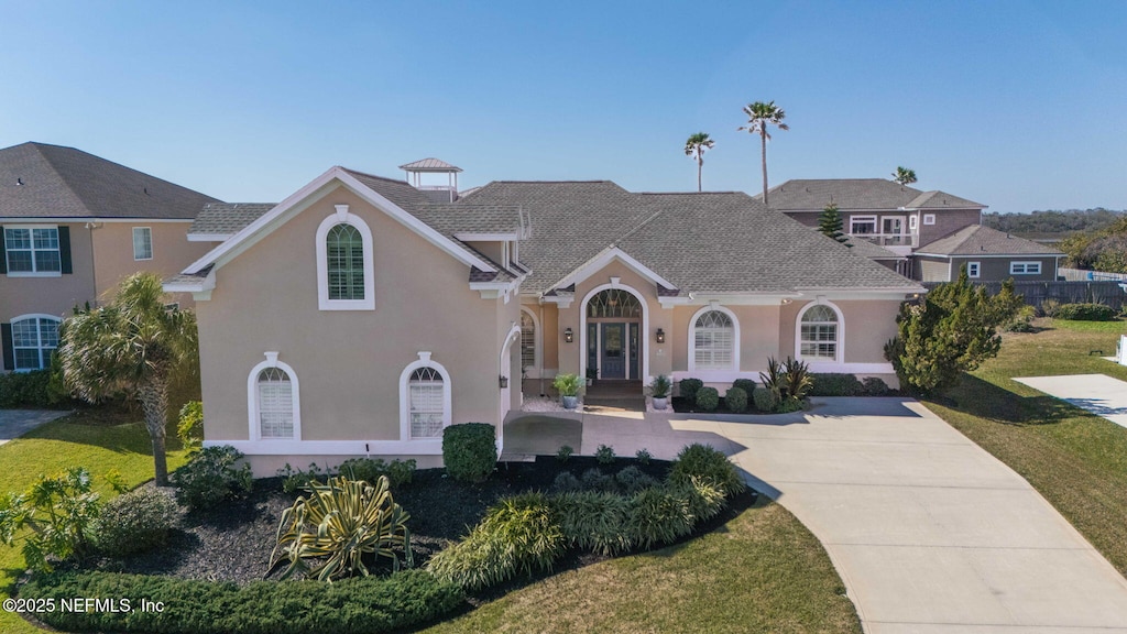 225 Hidden Dune Ct, Ponte Vedra, FL 32082 - mediterranean / spanish-style house featuring stucco siding and a front yard