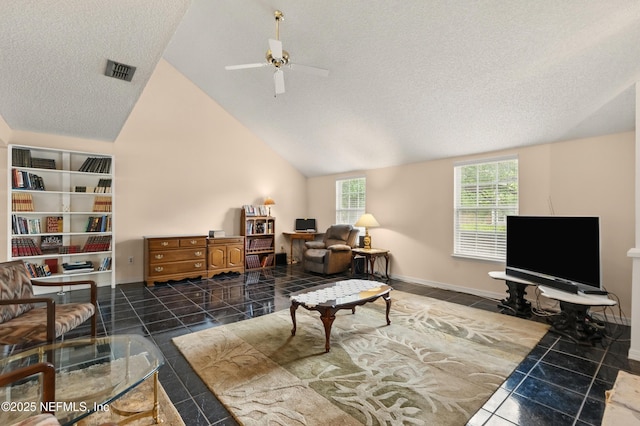 tiled living area with visible vents, lofted ceiling, baseboards, ceiling fan, and a textured ceiling