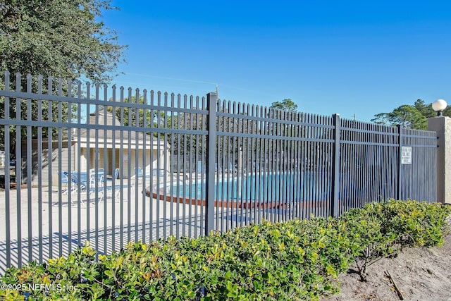 3801 Crown Point Rd Unit 1032, Jacksonville, FL 32257 - view of gate featuring a community pool and fence
