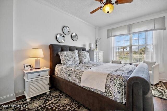 230 N Serenata Dr Unit 711, Ponte Vedra Beach, FL 32082 - bedroom featuring crown molding, baseboards, a ceiling fan, and dark wood-style flooring