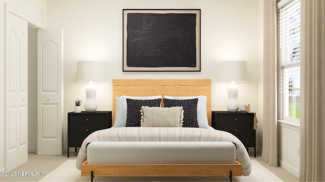 carpeted bedroom featuring baseboards
