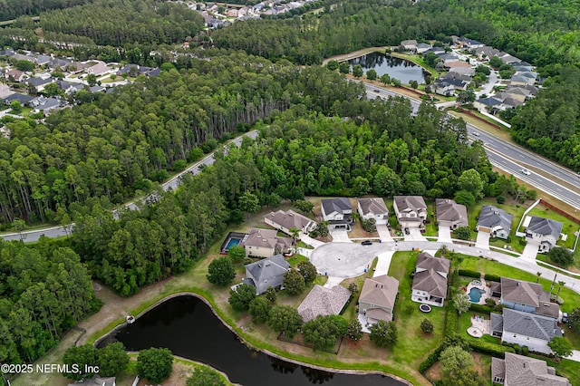 228 Gladstone Ct, Saint Johns, FL 32259 - aerial view of property and surrounding area featuring nearby suburban area, a forest, and a nearby body of water