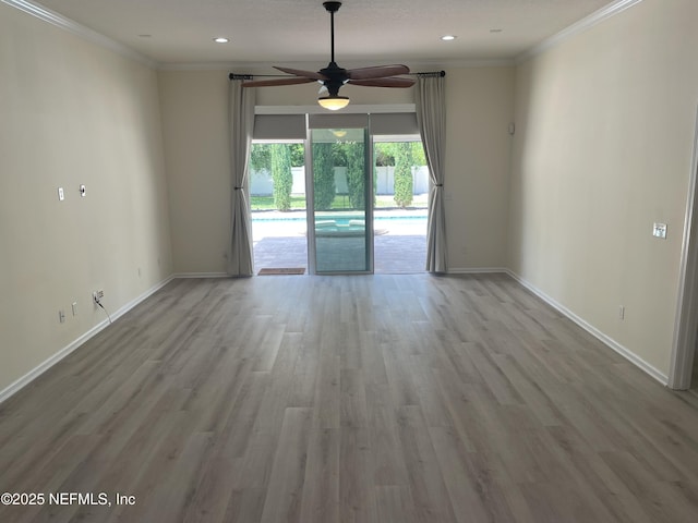 188 Irish Rose Rd, Saint Augustine, FL 32092 - spare room featuring a ceiling fan, baseboards, ornamental molding, and wood finished floors