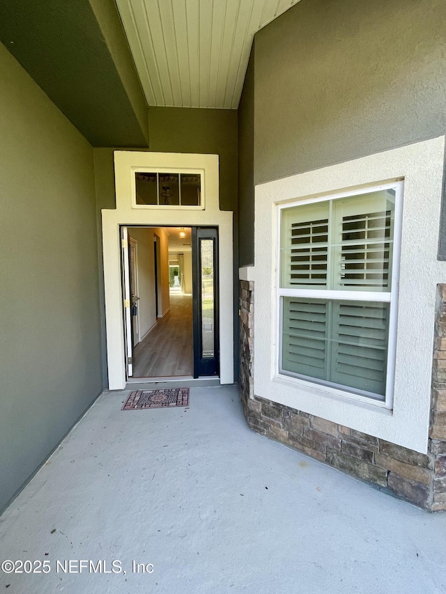 188 Irish Rose Rd, Saint Augustine, FL 32092 - entrance to property featuring stucco siding and stone siding