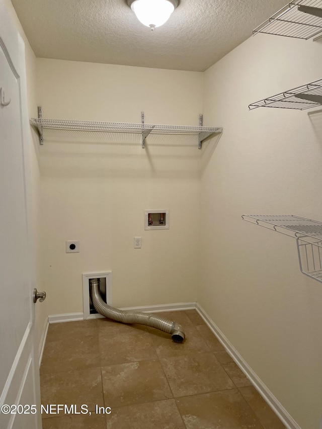 188 Irish Rose Rd, Saint Augustine, FL 32092 - clothes washing area with electric dryer hookup, laundry area, hookup for a washing machine, tile patterned floors, and baseboards