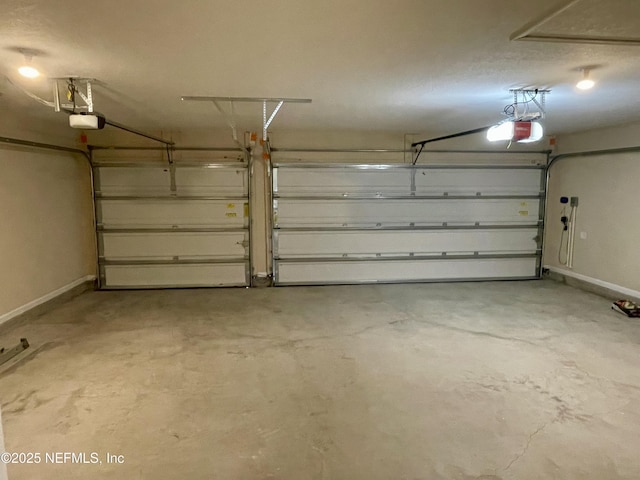 188 Irish Rose Rd, Saint Augustine, FL 32092 - garage with baseboards and a garage door opener