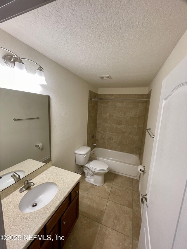 188 Irish Rose Rd, Saint Augustine, FL 32092 - full bathroom featuring a textured ceiling, toilet, visible vents, tile patterned flooring, and tub / shower combination