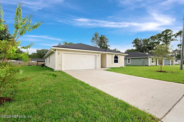 ranch-style house with concrete driveway, an attached garage, and a front lawn
