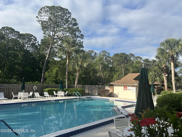 23 Salisbury Ct, Palm Coast, FL 32137 - community pool featuring fence and a patio