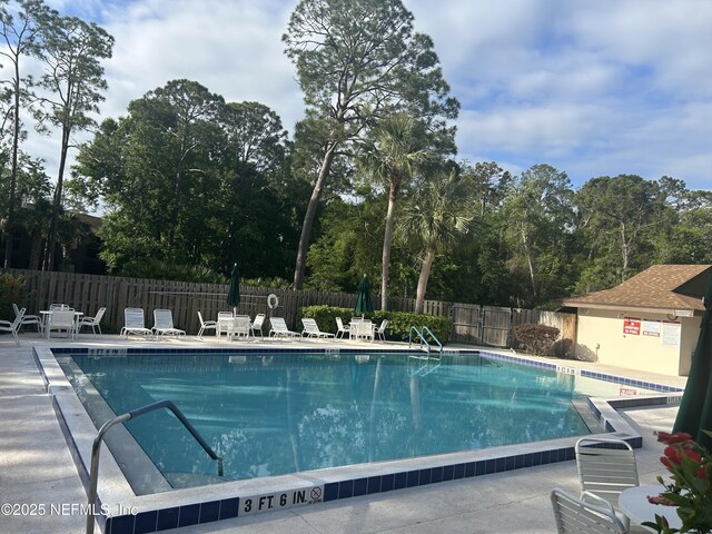 23 Salisbury Ct, Palm Coast, FL 32137 - pool with fence and a patio area