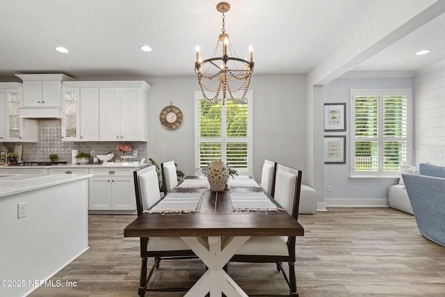 178 Edisto Pl, Saint Johns, FL 32259 - dining area with a chandelier, a textured ceiling, light wood-type flooring, recessed lighting, and baseboards
