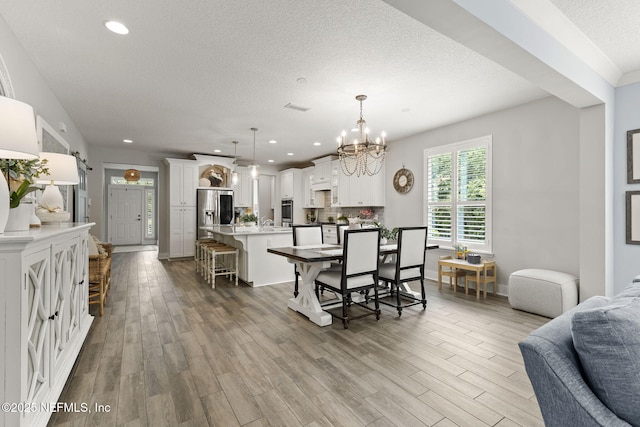 178 Edisto Pl, Saint Johns, FL 32259 - dining space with a textured ceiling, wood finished floors, a chandelier, and recessed lighting