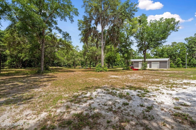 view of yard with a garage