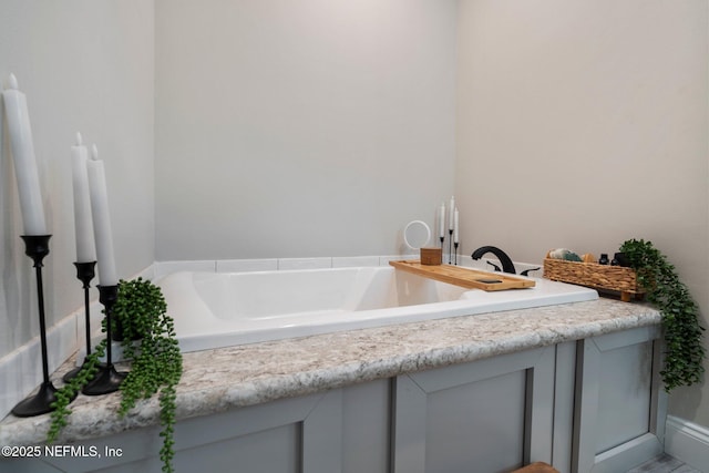 bathroom with a garden tub